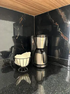 a coffee maker and a bowl on a counter at Chic apartment in a secure residence in Marrakech