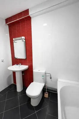 a bathroom with a white toilet and a sink at Appartement 2 Chambres 2 Balcons Gueliz in Marrakech