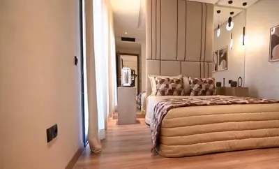 a bedroom with a large bed in a room at Luxury Apartment in Marrakech