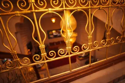 a gold fence in front of a window at Riad 16 Dar and Pool in Marrakech
