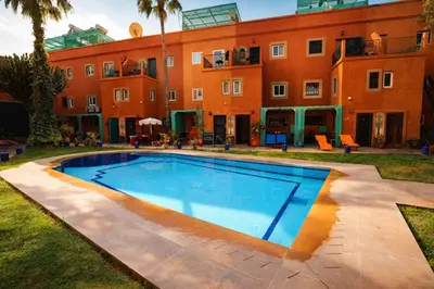 an image of a swimming pool in front of a building at Riad 16 Dar and Pool in Marrakech