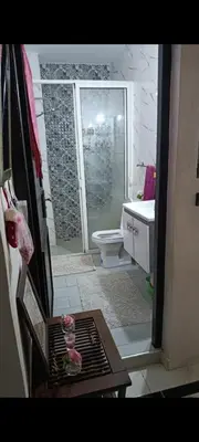 a bathroom with a shower and a toilet and a sink at Afaq1,saada in Marrakech