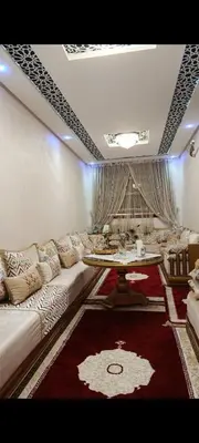 a living room with a couch and a table at Afaq1,saada in Marrakech