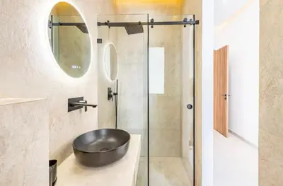 a bathroom with a sink and a shower at Kais in El Rhechat
