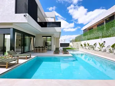 a swimming pool in the backyard of a house at Kais in El Rhechat