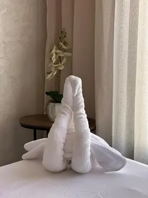 a towel made to look like a legs on a bed at Marrakesh Heated Pool Sport and Jacuzzi in Marrakech