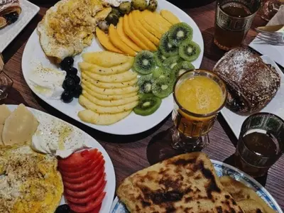 a table with two plates of breakfast foods and drinks at The best JINANE in Marrakech