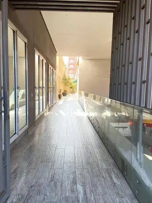 an empty hallway of a building with windows at Studio Premium au Cœur de Guéliz in Marrakech