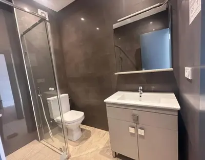 a bathroom with a toilet and a sink and a shower at Studio Premium au Cœur de Guéliz in Marrakech
