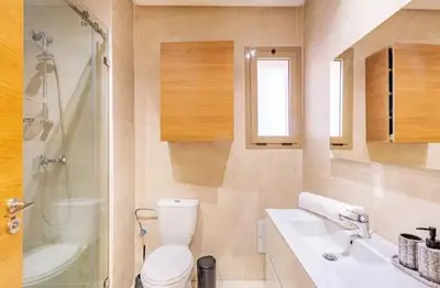 a bathroom with a toilet and a sink and a shower at Prestigia Golf Resort Luxury in Marrakech