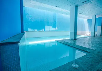 a large swimming pool in a building at Le Chic Urbain Tout à Pied Clim Design Chic in Marrakech