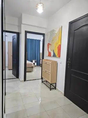 a room with a dresser and a bedroom at Chya home in Marrakech