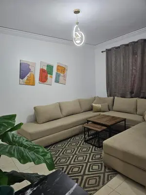 a living room with a couch and a table at Chya home in Marrakech