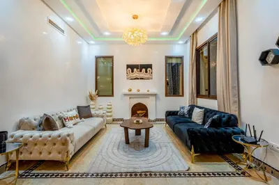 a living room with couches and a fireplace at Andalusian Dream Villa pool and balcony in Marrakech