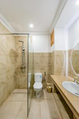 a bathroom with a toilet and a sink and a shower at Andalusian Dream Villa pool and balcony in Marrakech