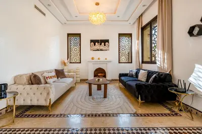 a living room with a couch and a table at Andalusian Dream Villa pool and balcony in Marrakech