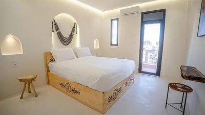 a bedroom with a bed and a mirror on the wall at Majorelle Garden - Design apartment in Marrakech