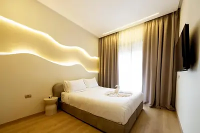 a hotel room with a bed and a window at Prestigia Exceptional apartment with pool view in Marrakech