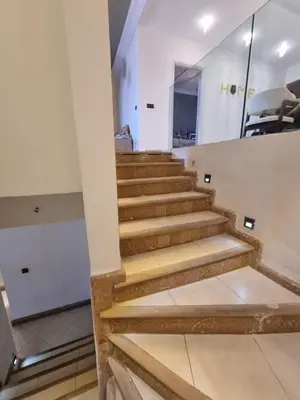 a set of stairs in a building with a mirror at Palais Majorelle - Entire Chic 3Bedrms 3Bathrms Duplex in Marrakech with Majorelle View, 2 Lounges, Prime Central Location in Marrakech