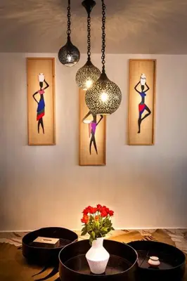 a room with paintings of dancers on the wall at Loft house Marrakech in Marrakech