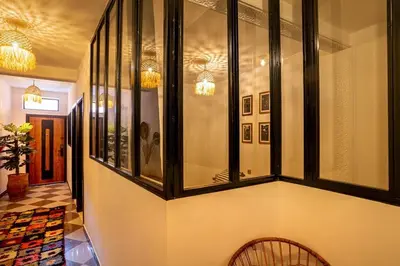 a hallway with a bunch of glass windows at Loft house Marrakech in Marrakech
