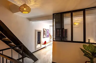 a hallway with a staircase in a house at Loft house Marrakech in Marrakech