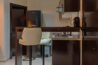 a kitchen with a desk and a chair in a room at Hotel-Style Studio - High speed internet - Parking in Marrakech