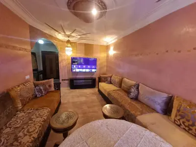 a living room with couches and a flat screen tv at Appartement Laila Guéliz - Victor Hugo in Marrakech