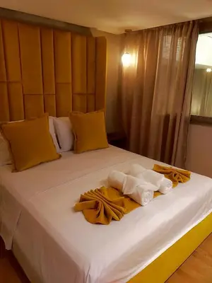 a large white bed with towels on it at Duplex High Standing-0 Fees Service-10 min Gueliz in Marrakech