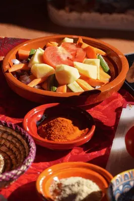 two bowls of fruit and vegetables on a table at Berber House Authentic Moroccan Farm Stay in El Rhechat