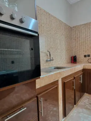 a kitchen with a sink and a microwave at Chamali House Peaceful Nature Farm Stay Ferme Zarraba in El Rhechat