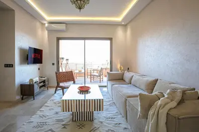 a living room with a couch and a table at 2 bedroom apartment, 4 people, near Jardin Majorelle in Marrakech