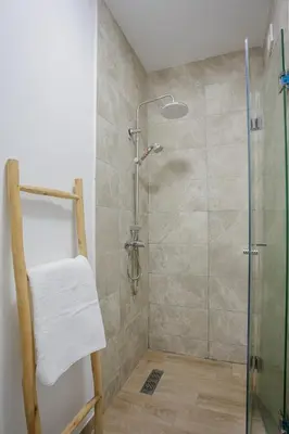 a bathroom with a shower with a glass door at 2 bedroom apartment, 4 people, near Jardin Majorelle in Marrakech