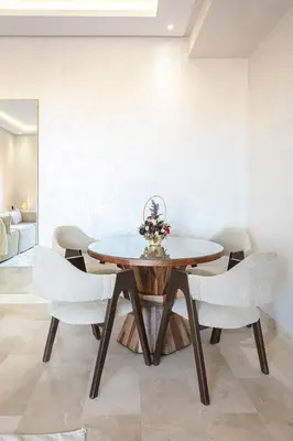a dining room with a table and chairs at 2 bedroom apartment, 4 people, near Jardin Majorelle in Marrakech