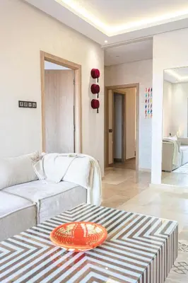 a living room with a couch and a table at 2 bedroom apartment, 4 people, near Jardin Majorelle in Marrakech