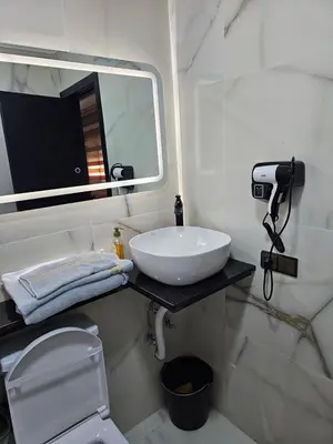 a bathroom with a white sink and a mirror at مراكش in Marrakech
