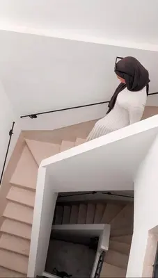 a person sitting on top of a stair case at Stunning penthouse in city center in Marrakech