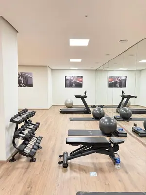 a gym with lots of exercise equipment in a room at Stylish and cozy accommodation for families in Marrakech