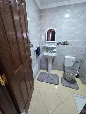 a bathroom with a toilet and a sink at Appartement Lady Plaza 3 in Marrakech