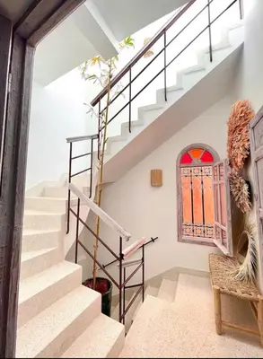 a staircase in a house with a window at Riad Mtiwel in Marrakech