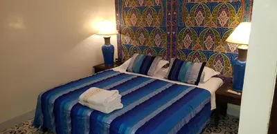 a hotel room with a bed with towels on it at Riad Konouz in Marrakech