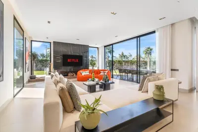 a living room filled with furniture and a fireplace at VILLA Twenty six 1600m2 Marrakech LUXE & PROXIMITÉ in Marrakech