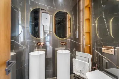 a bathroom with three mirrors and a sink at VILLA Twenty six 1600m2 Marrakech LUXE & PROXIMITÉ in Marrakech