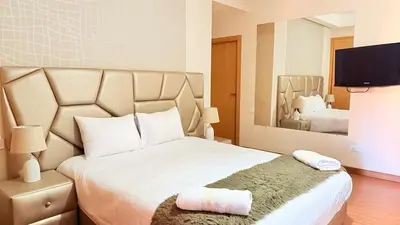a bedroom with a large bed with a large mirror at Chic Stay in Gueliz 4 Free Parking Netflix in Marrakech