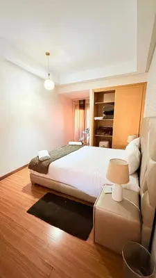 a bedroom with a large bed and a couch at Chic Stay in Gueliz 4 Free Parking Netflix in Marrakech