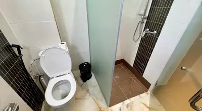 a bathroom with a toilet and a shower at Appartement cozy in Marrakech