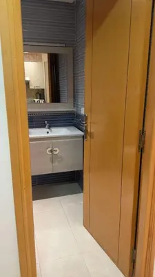 a bathroom with a sink and a mirror at Location Centrale - Heated 1BR - Parking - Netflix in Marrakech