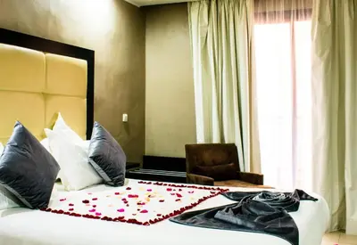 a hotel room with a bed with flowers on it at Chambre double Standard in Marrakech