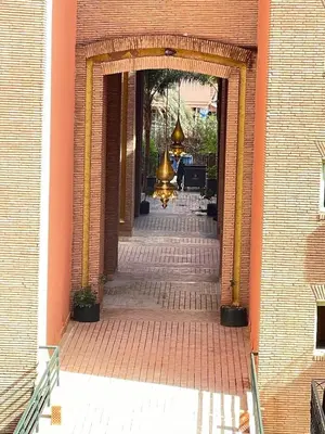 an entrance to a building with an archway at nice apartment, Luxury Wintering, Caprice Palace in Marrakech