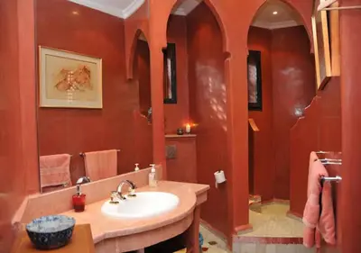 a bathroom with a sink and a large mirror at Private villa Marrakech in Marrakech